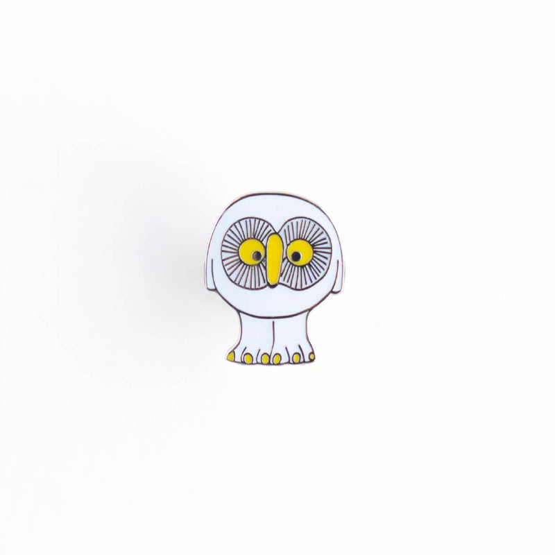 Pins (white owl in the Swedish forest)