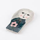 Girl with a pink flower